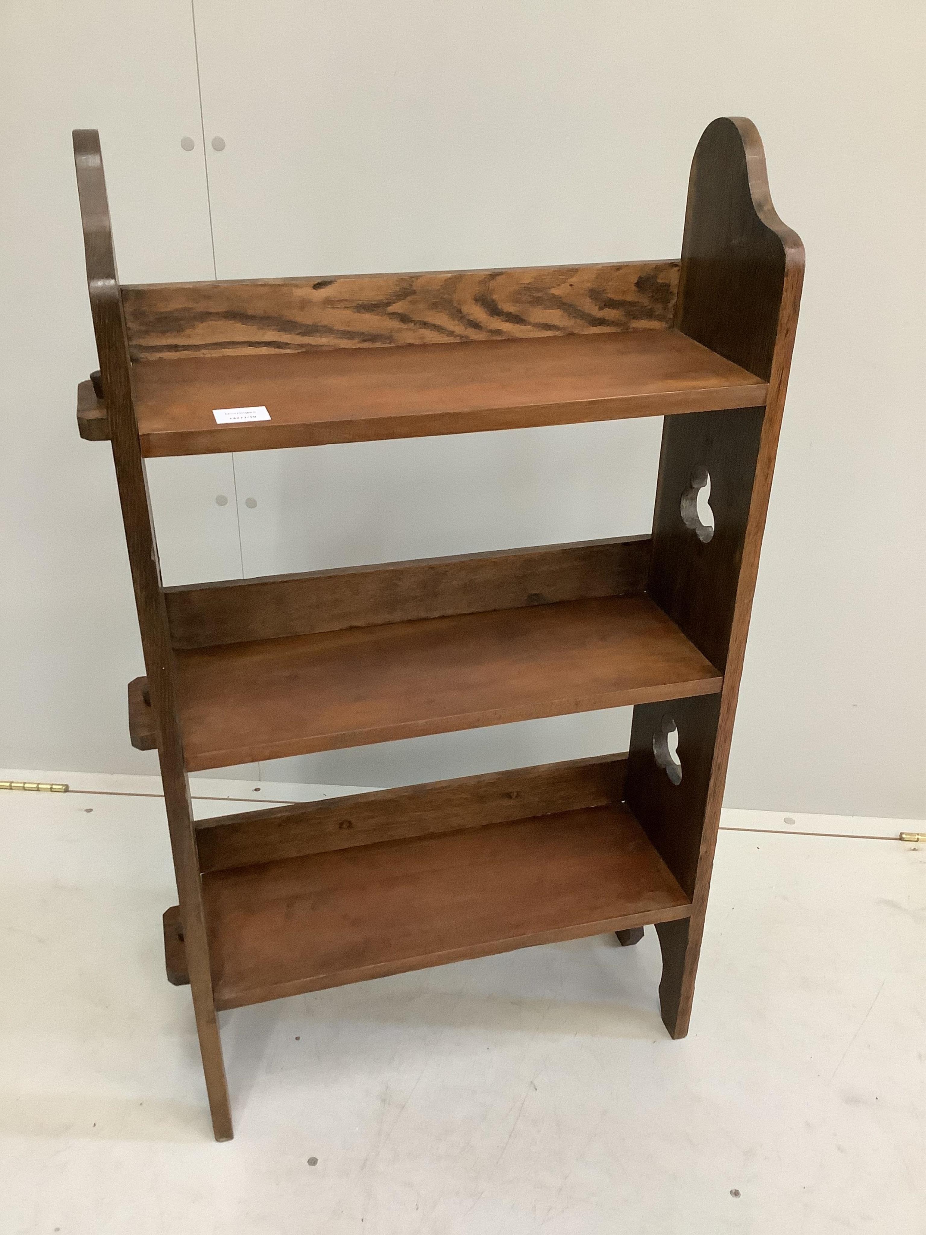 An Arts & Crafts oak open bookcase, width 58cm, depth 19cm, height 97cm